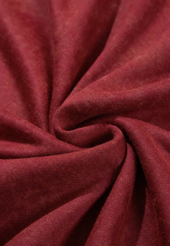 Close-up of maroon sweatshirt fabric with soft knit texture