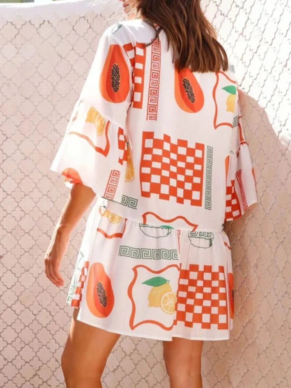 Printed mini dress with belt at waist, white with orange fruit and tile motifs, three-quarter sleeves