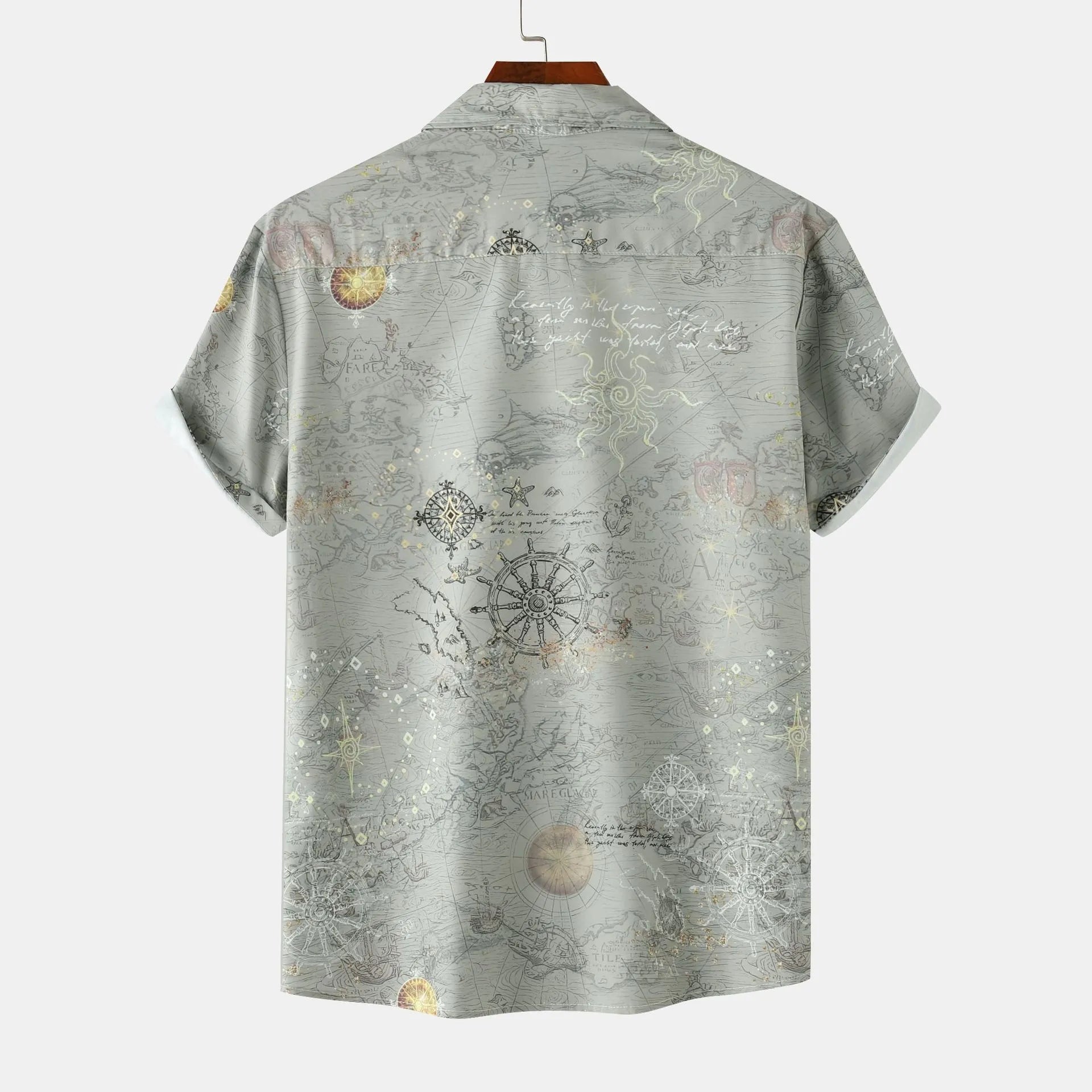Men’s printed short-sleeve button-up shirt in light gray-green with back view compass and moon motifs.