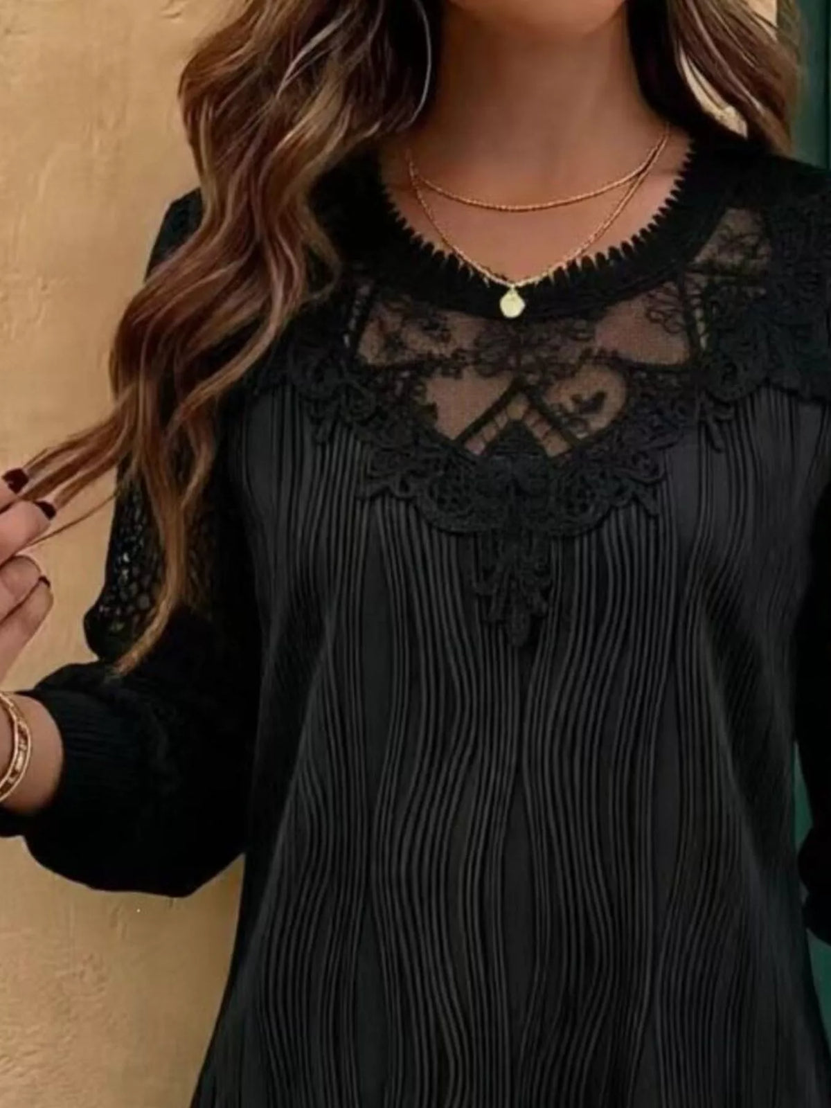 Black lace yoke blouse with vertical pleat texture and long sleeves with lace trim
