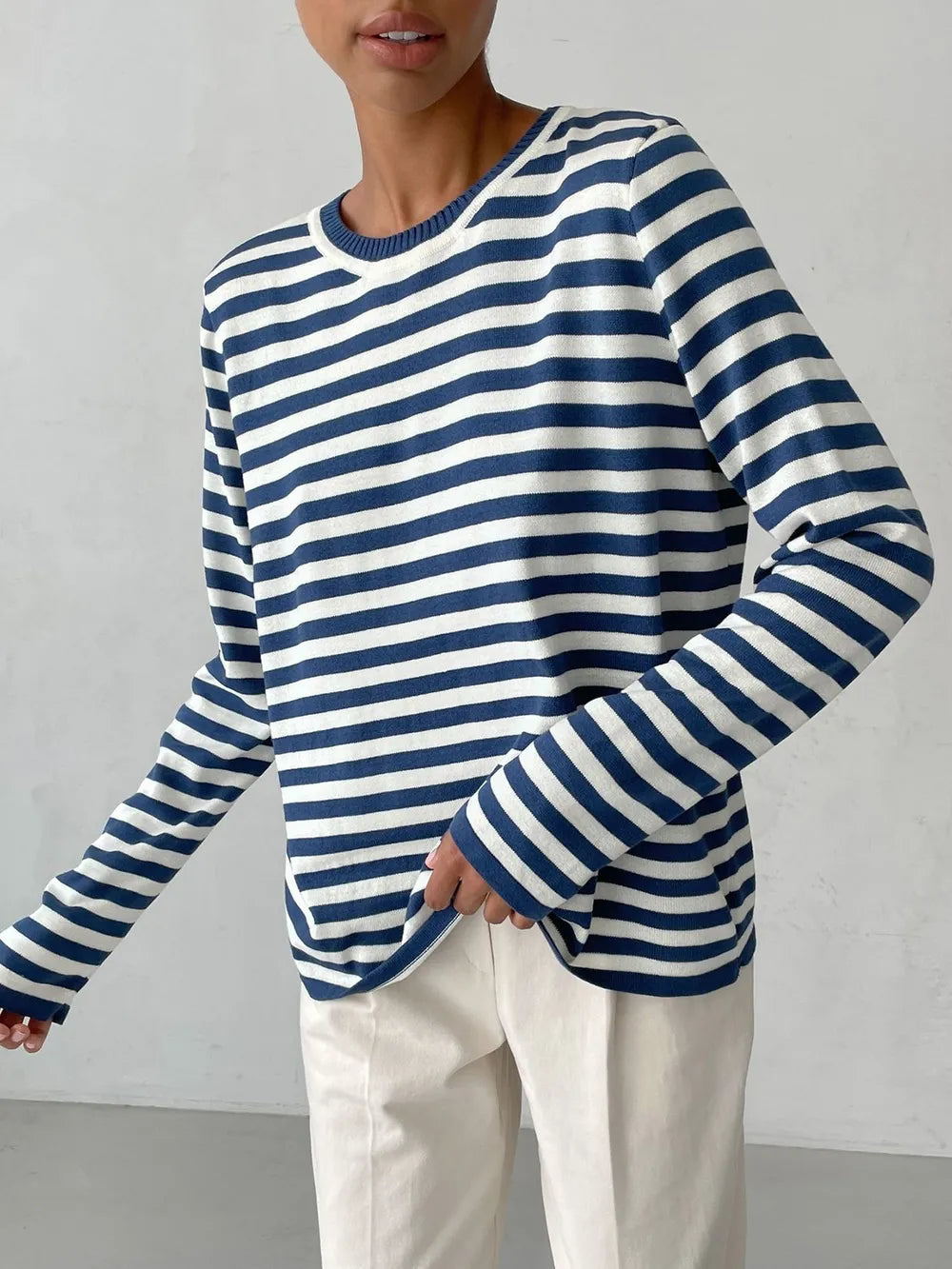 Striped long-sleeve sweater in navy and white, crew round neck.