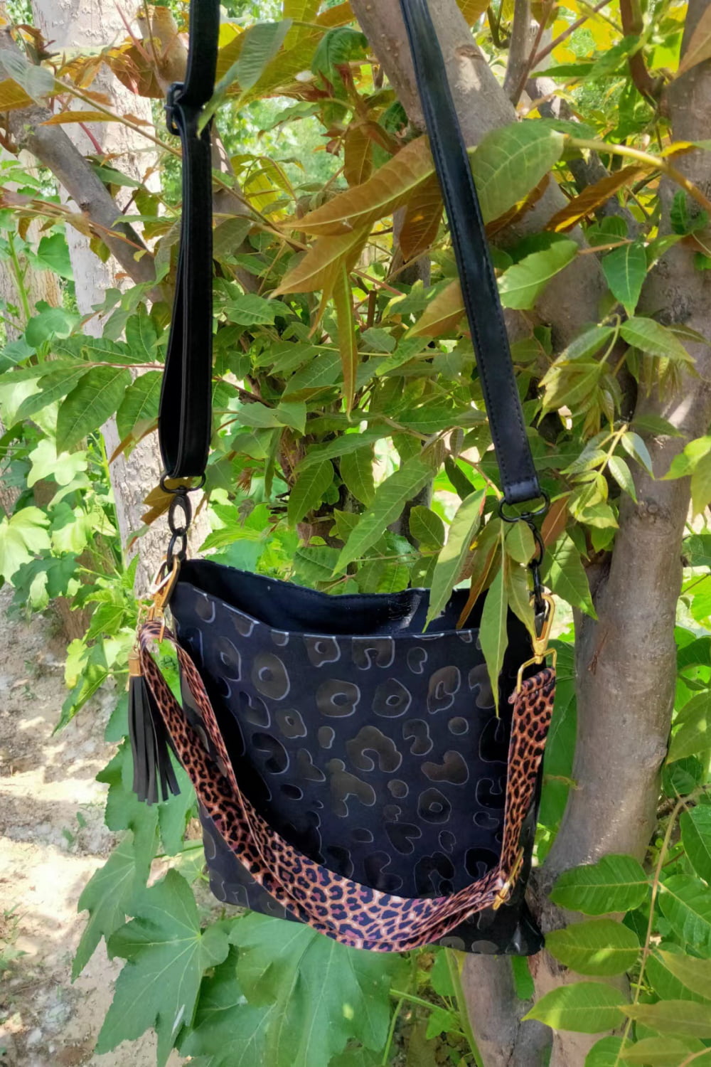 Black PU leather shoulder bag with embossed pattern, leopard trim strap, long shoulder straps