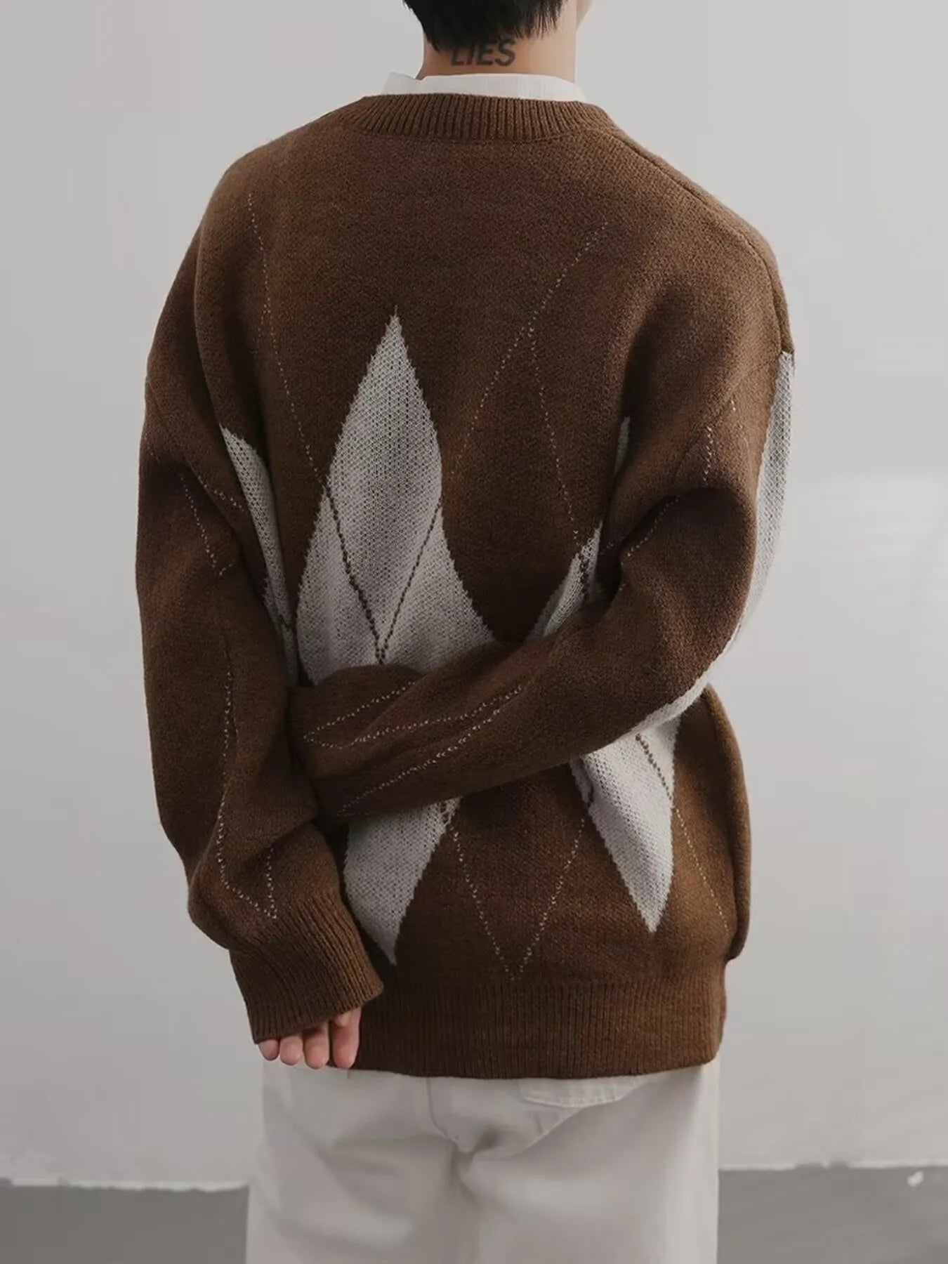 Brown and cream argyle oversized knit sweater, back view with diamond pattern