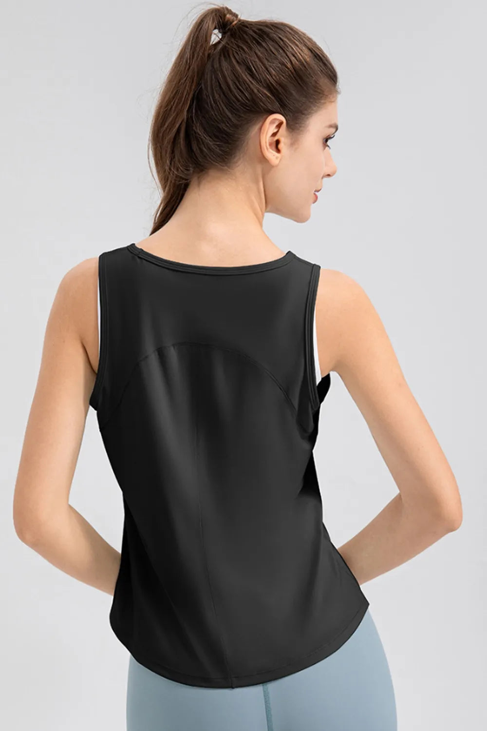 Women’s black active tank top, back view with wide straps and round neckline