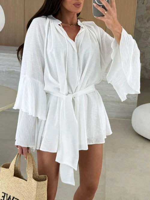 White bell sleeve mini shirt dress with self-tie waist and ruffled cuffs