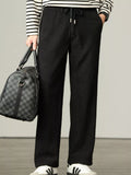 Black corduroy drawstring relaxed-fit pants with side seam pockets
