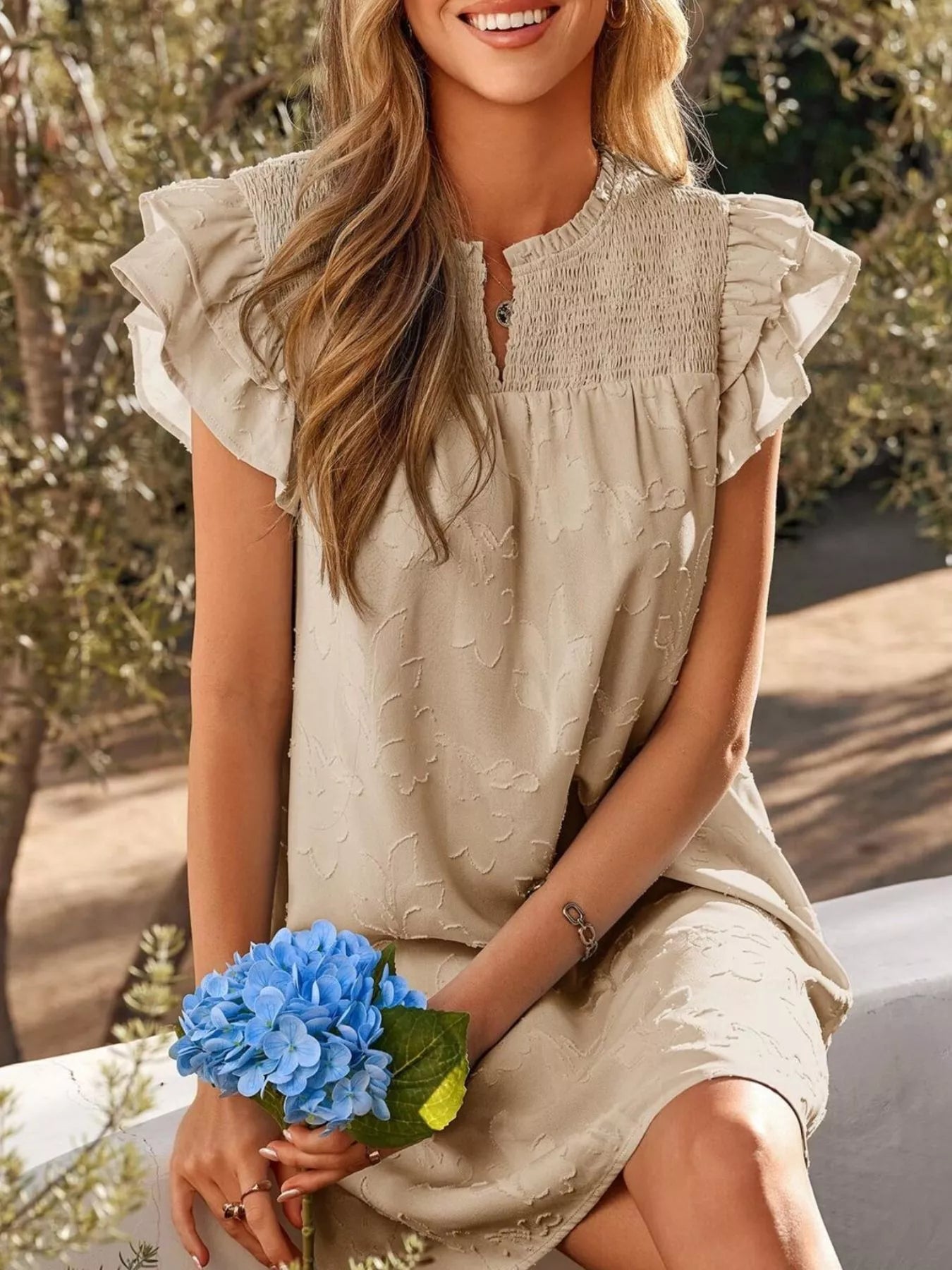 Floral Embossed Ruffle Sleeve Mini Dress in beige by Trendsi with smocked bodice.