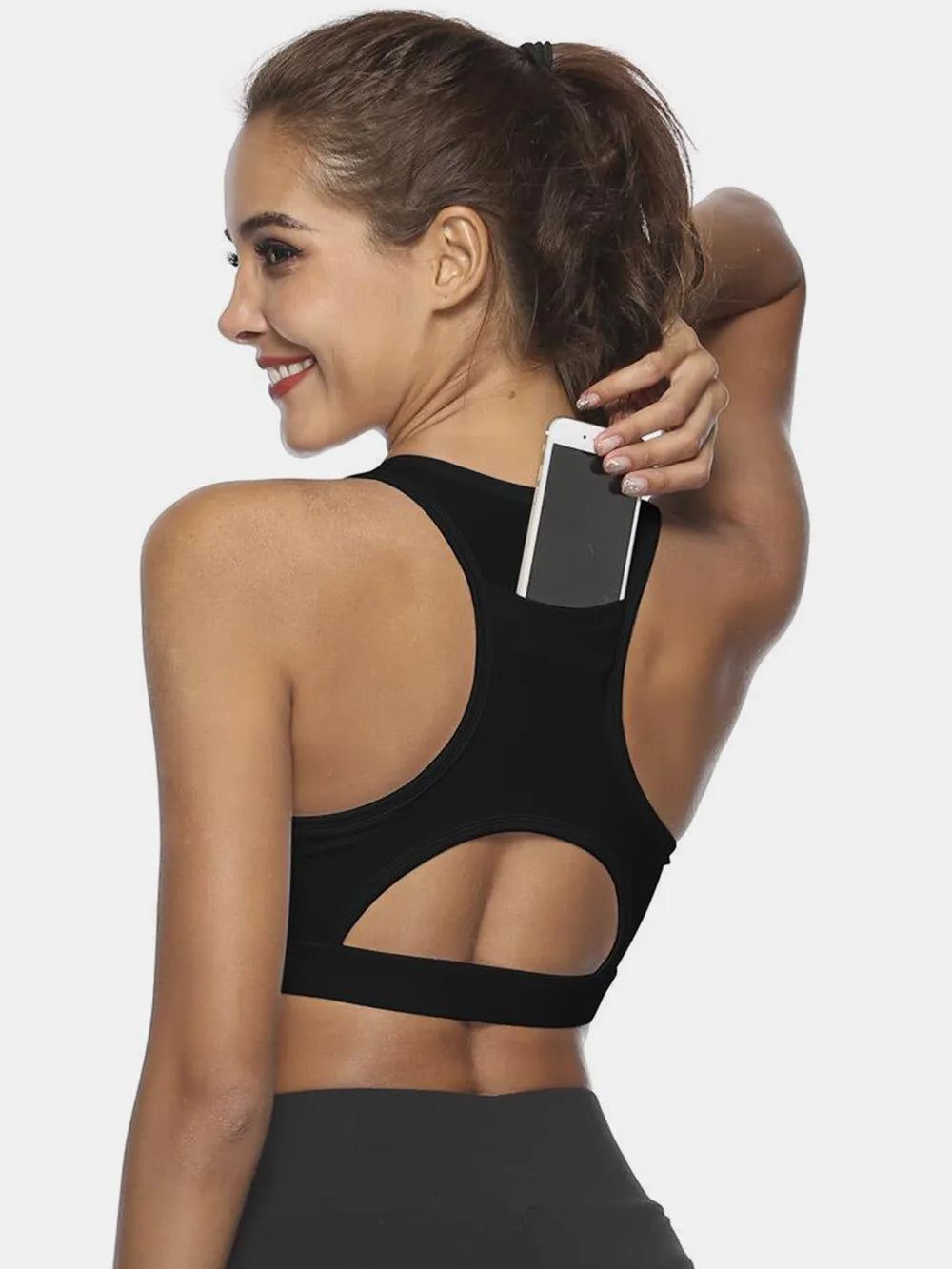 Black active tank with scoop neck; cutout back and sporty hemline