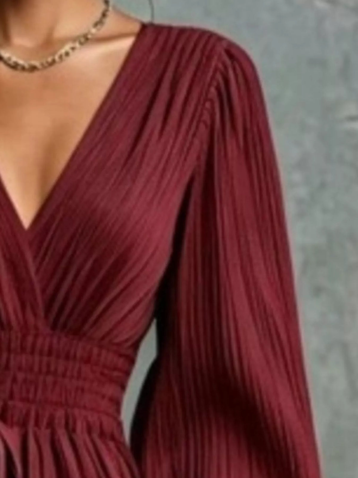 Wine red pleated V-neck maxi dress with gathered waist detail close-up