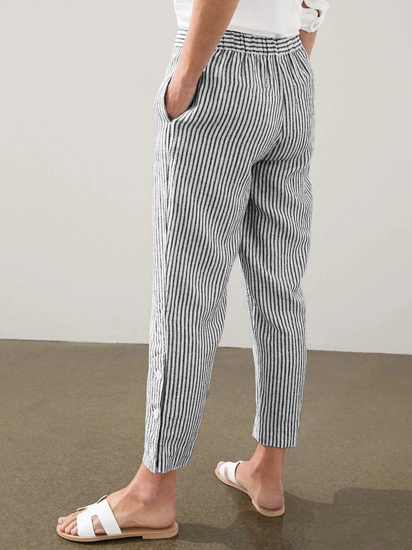 Plus size striped side-button detail pants in black and white, cuffed ankle length