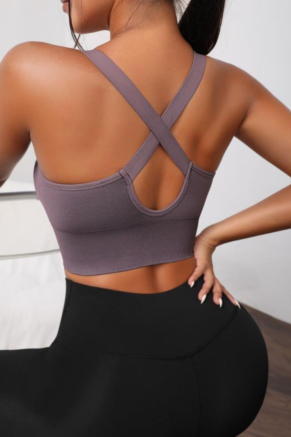 Mauve active bra with crisscross racerback straps and scoop back neckline