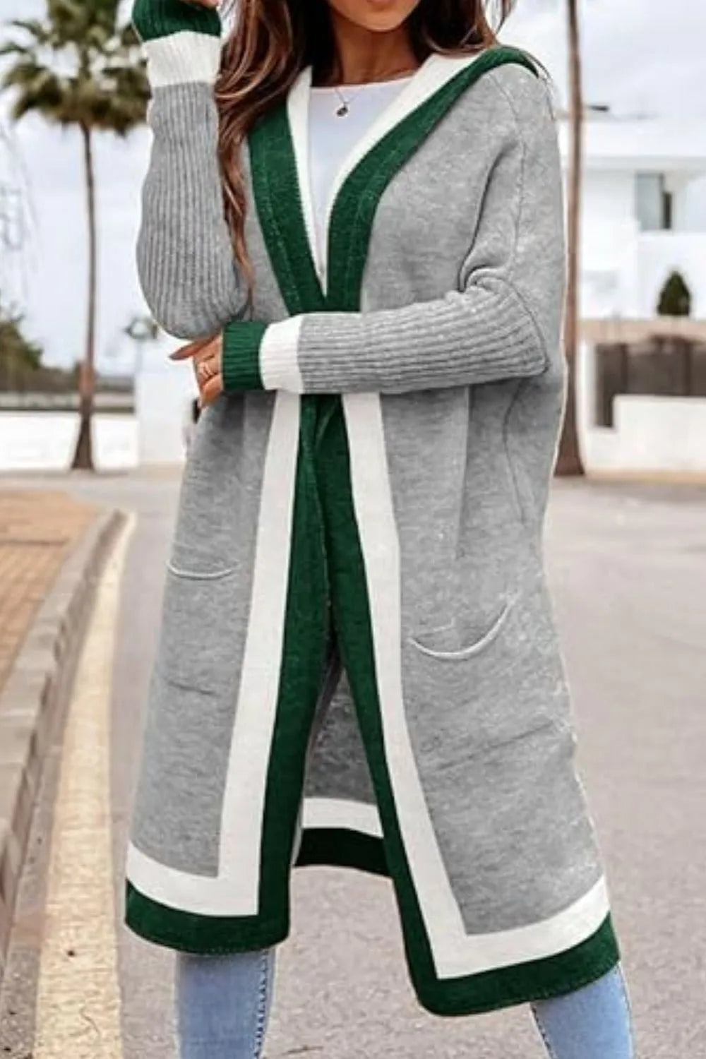 Long hooded cardigan with patch pocket and bold green contrast trim on gray fabric