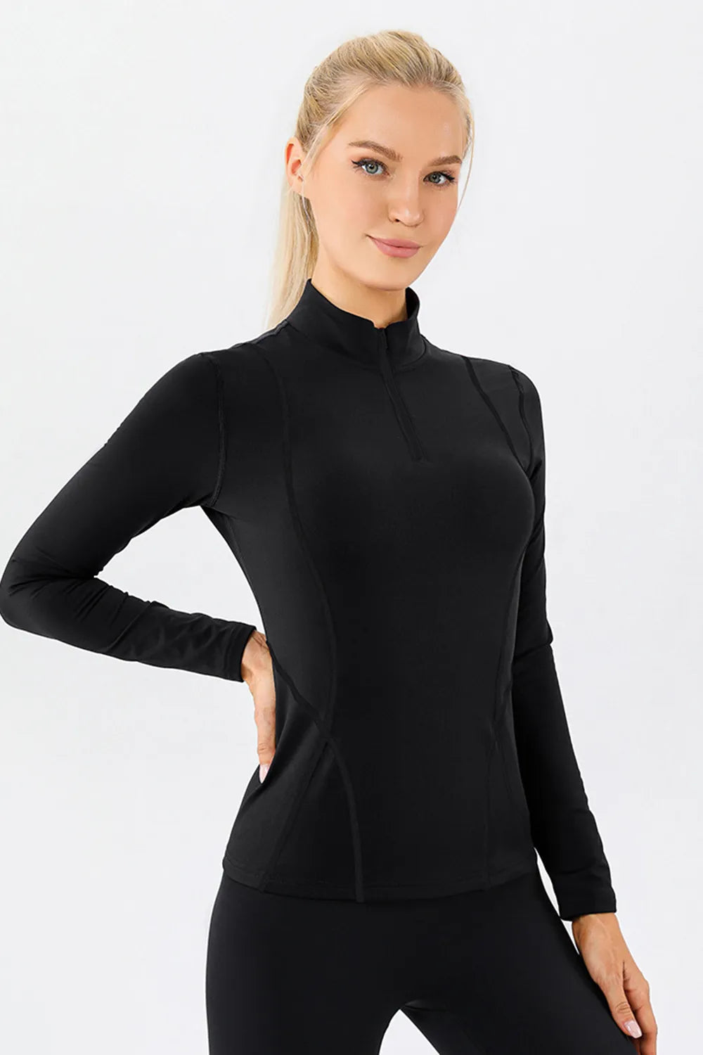 Mock neck active t-shirt in black, long sleeves, front side view
