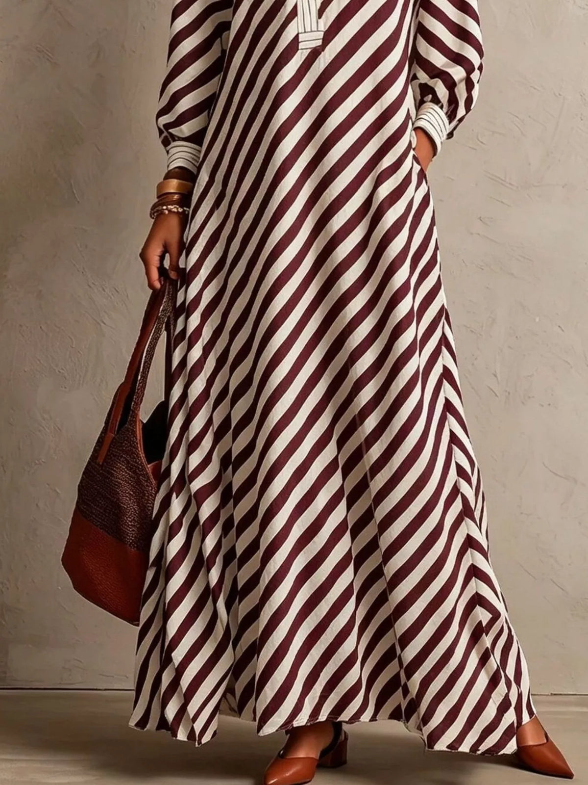 Burgundy-and-white striped maxi dress with flowing hem and gathered sleeves