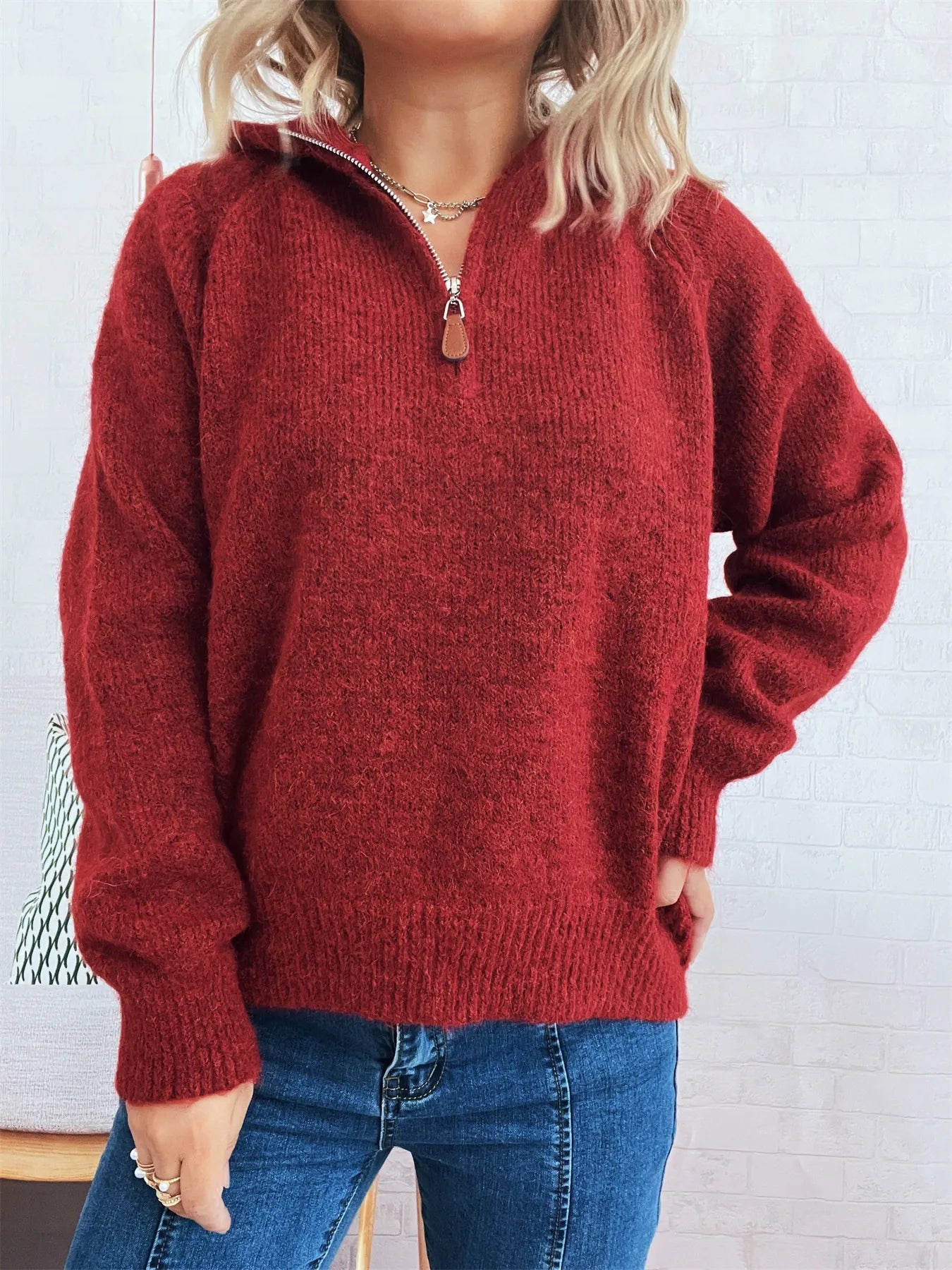 Burgundy quarter-zip ribbed hem sweater with zipper pull and collar