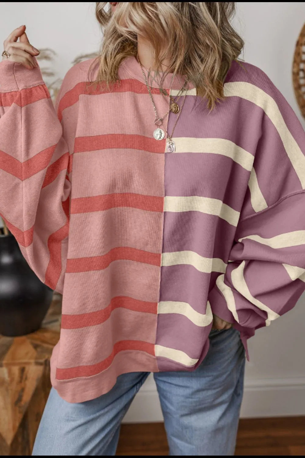 Dusty pink and mauve contrast striped long-sleeve sweatshirt, chest close-up