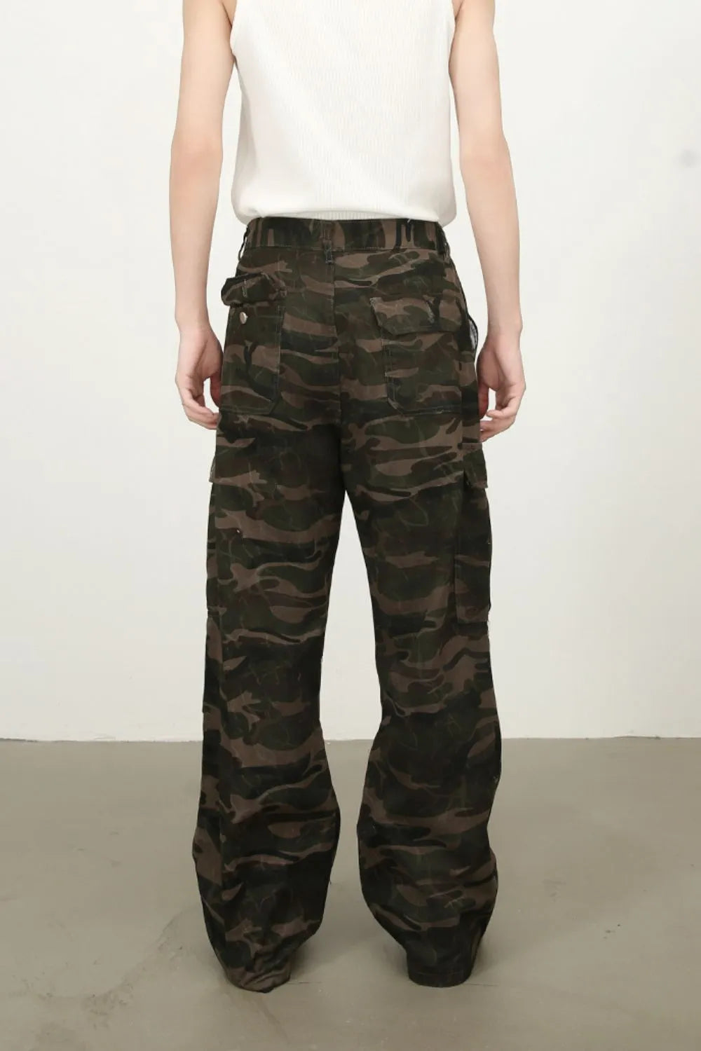 Men's green camouflage cargo jeans with relaxed straight fit and flap cargo pockets