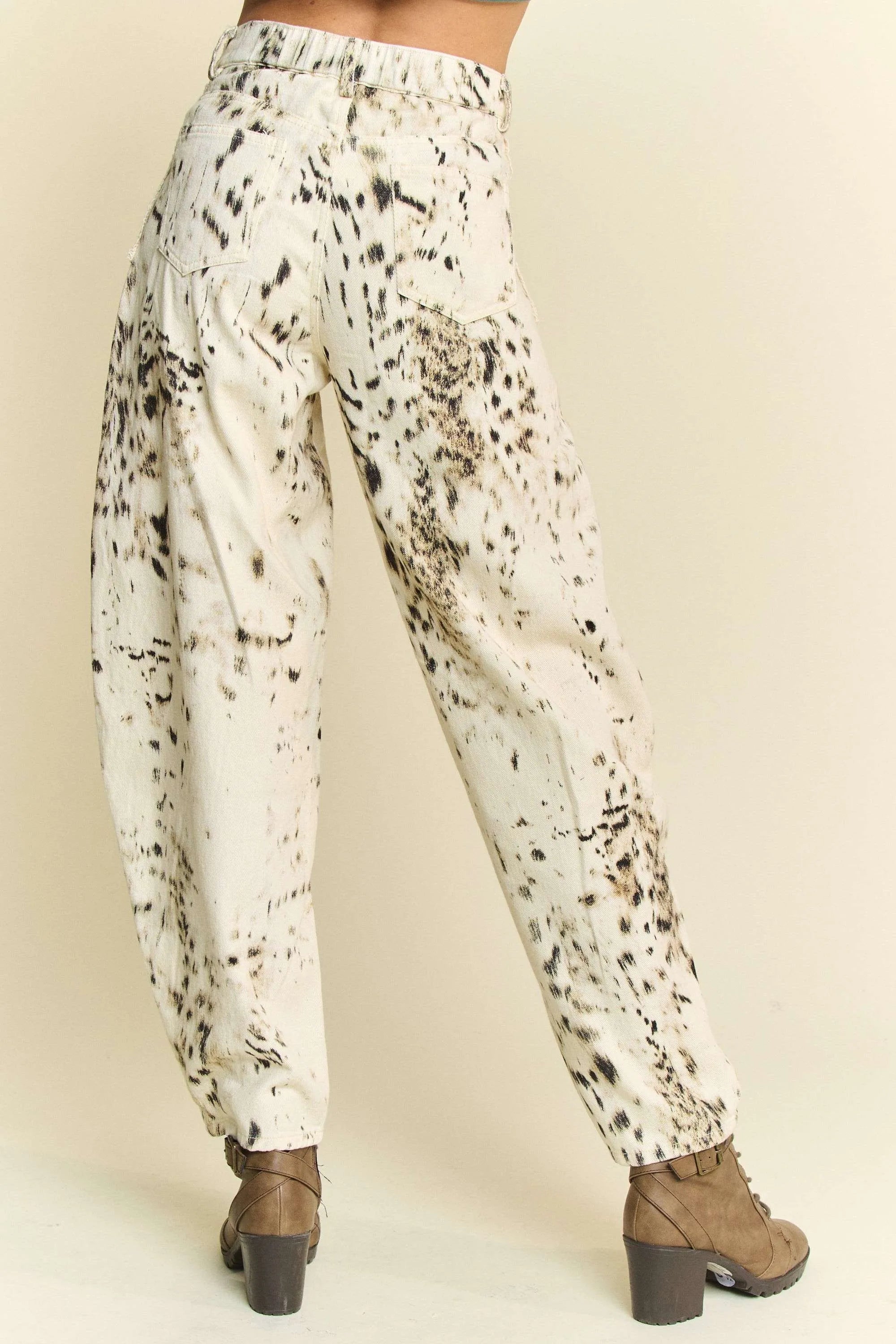 Cream barrel-leg pants with abstract black speckle dot print and elastic waist
