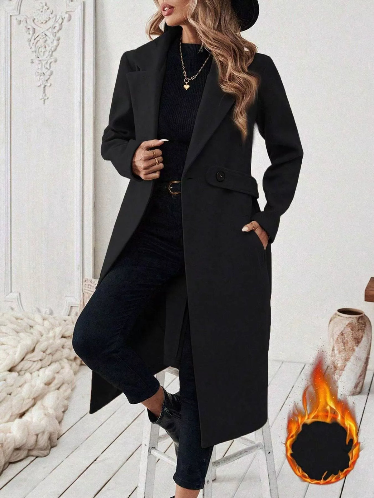 Women’s longline single-button coat, black, notched lapels and flap pockets.