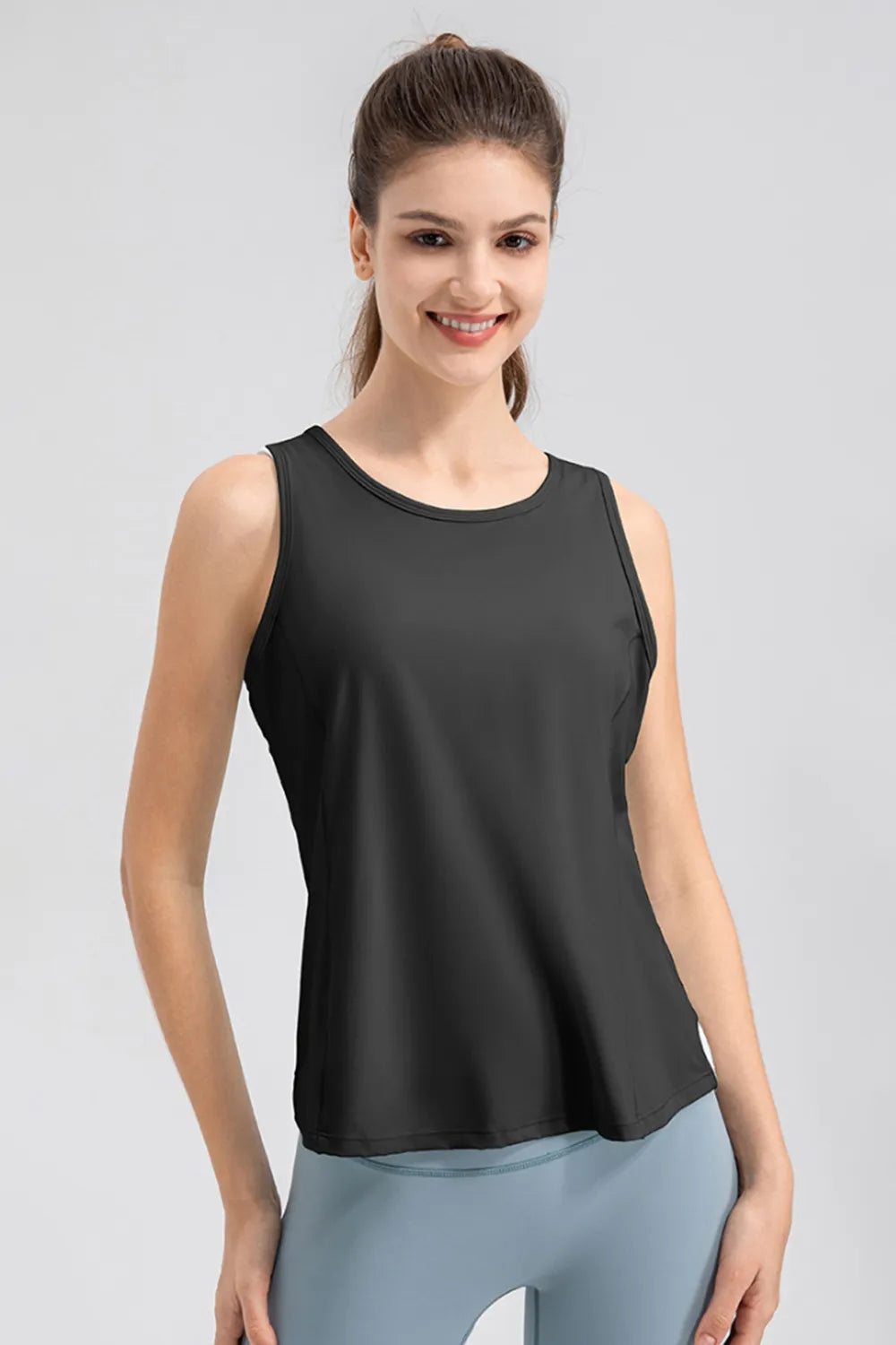 Women’s black active tank top with wide straps and a round neckline
