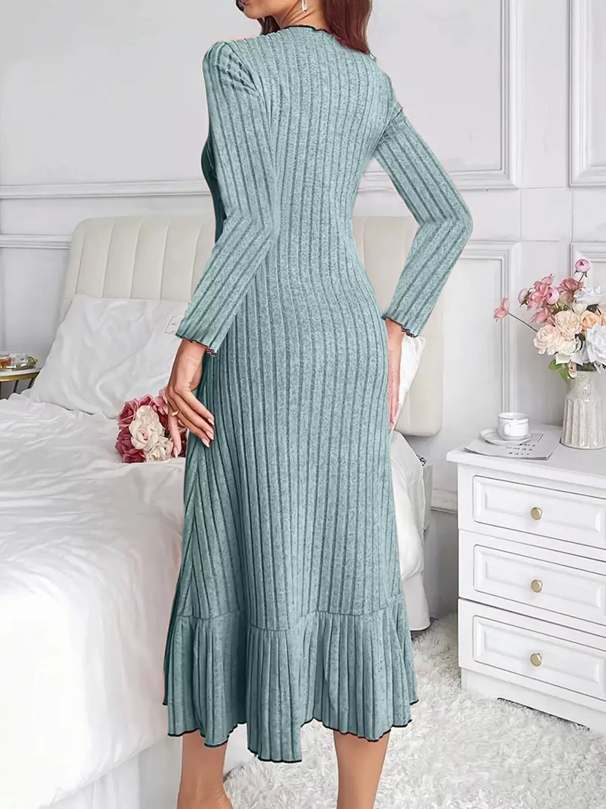 Turquoise ribbed knit bodycon dress, long sleeves and ruffle hem—back view