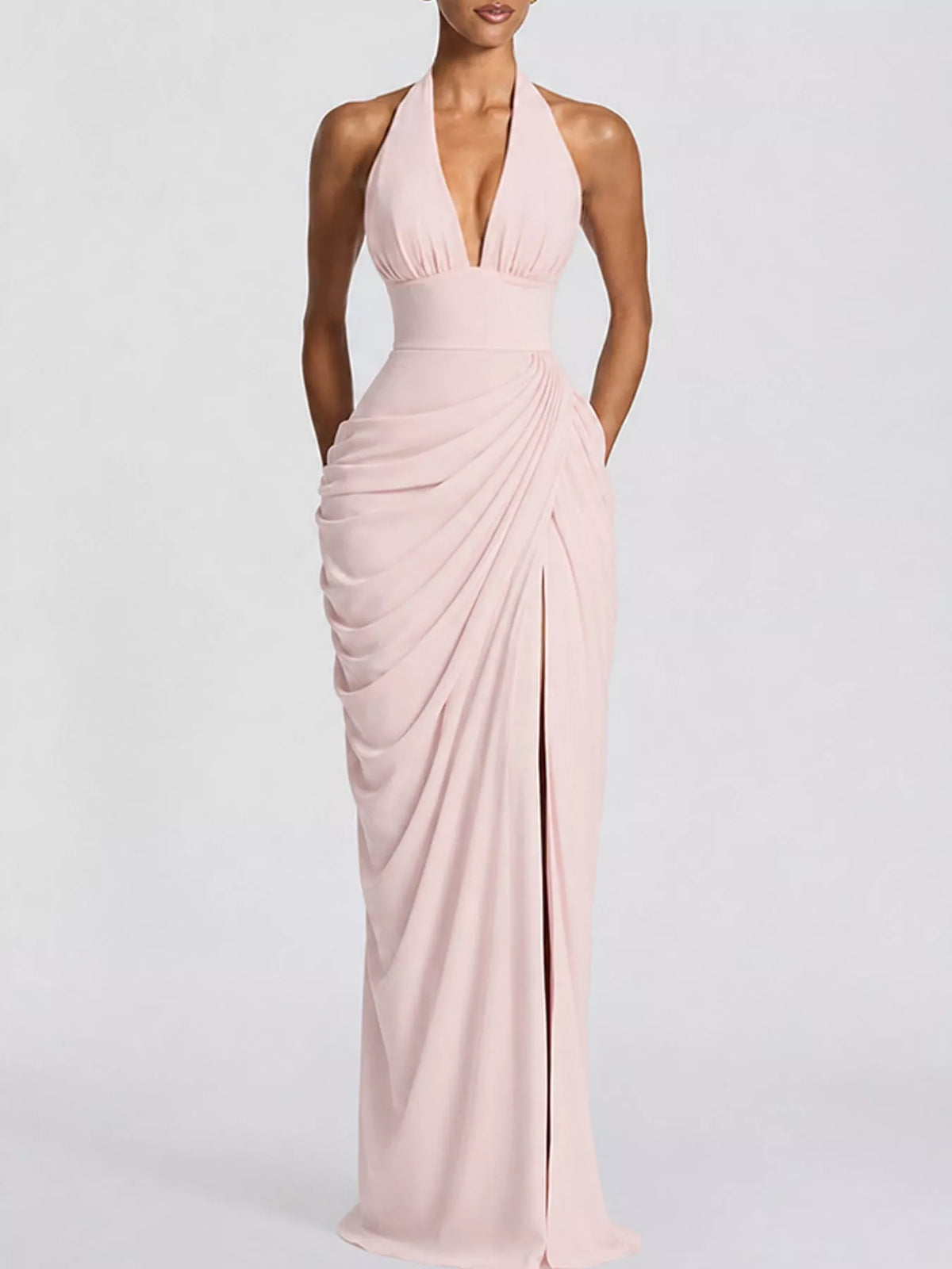 Pink halter neck maxi dress with deep V front, ruched wrap drape, and high slit