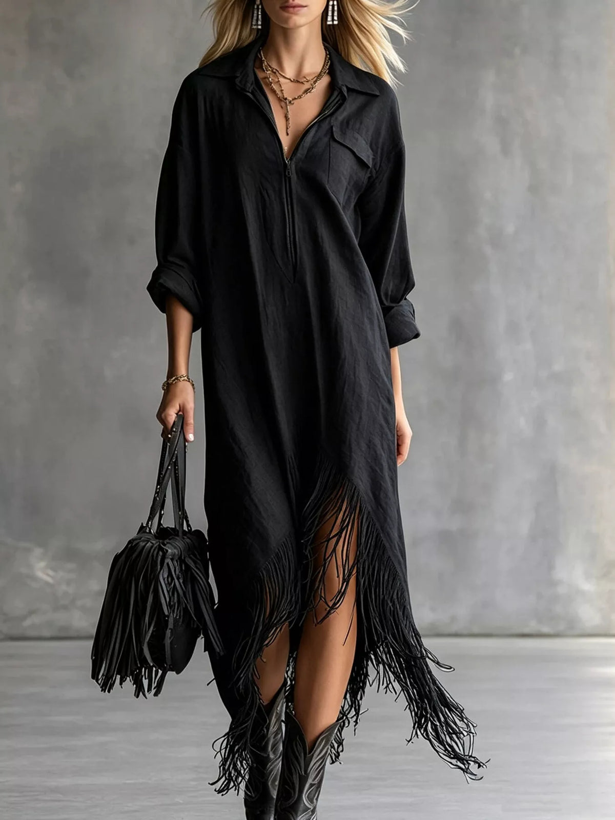 Black zip-front shirt dress with fringe hem and three-quarter roll sleeves