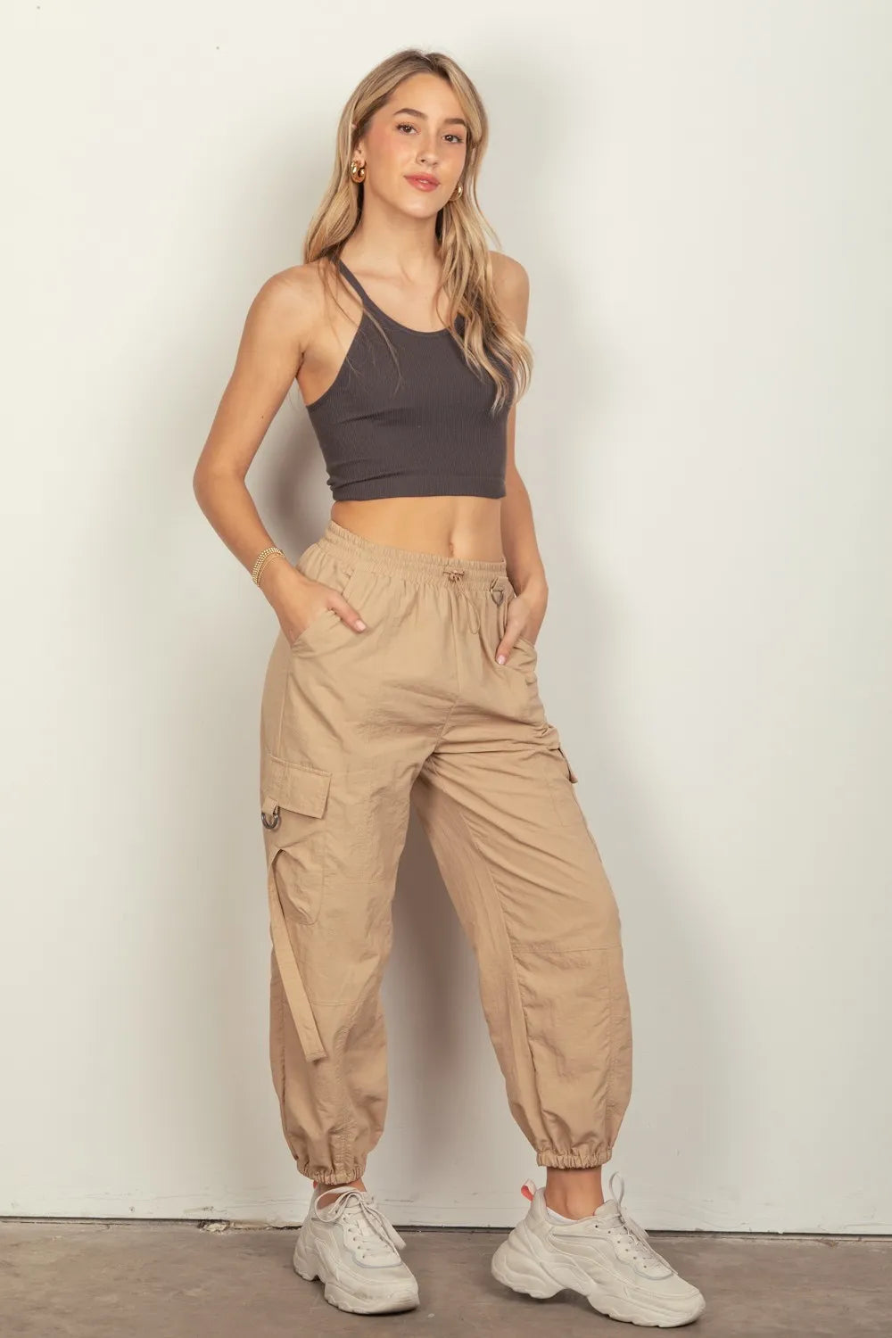 Taupe elastic waist woven cargo pants with side pockets and drawstring cuffs