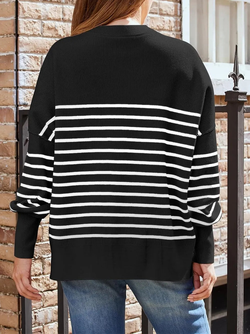 Black crew-neck sweatshirt back view with white horizontal stripe panel