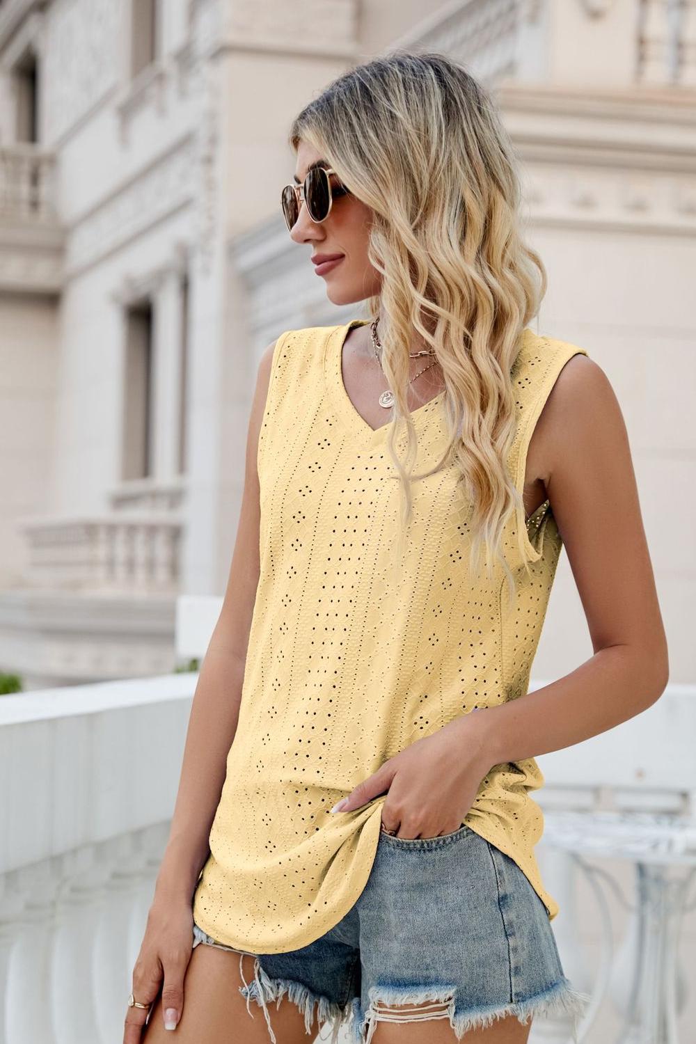Yellow eyelet V-neck tank with sleeveless lace cutout pattern and side knot
