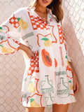 Printed mini dress with three-quarter sleeves, white base and orange check and fruit motifs