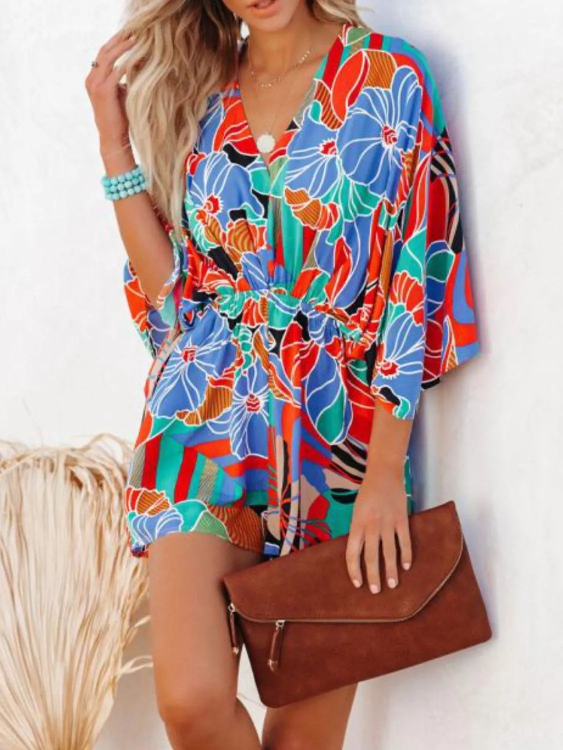Floral printed romper with V-neck and tie-back neckline, loose long sleeves