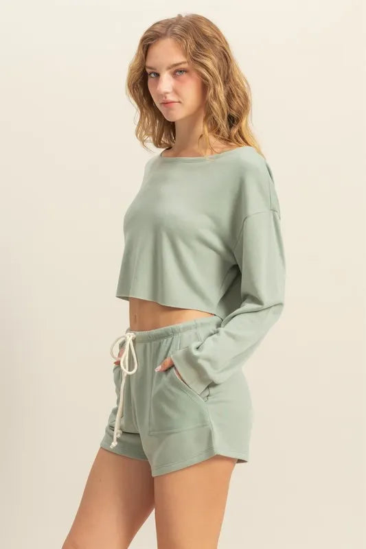 Sage green boat-neck long-sleeve cropped top, side view