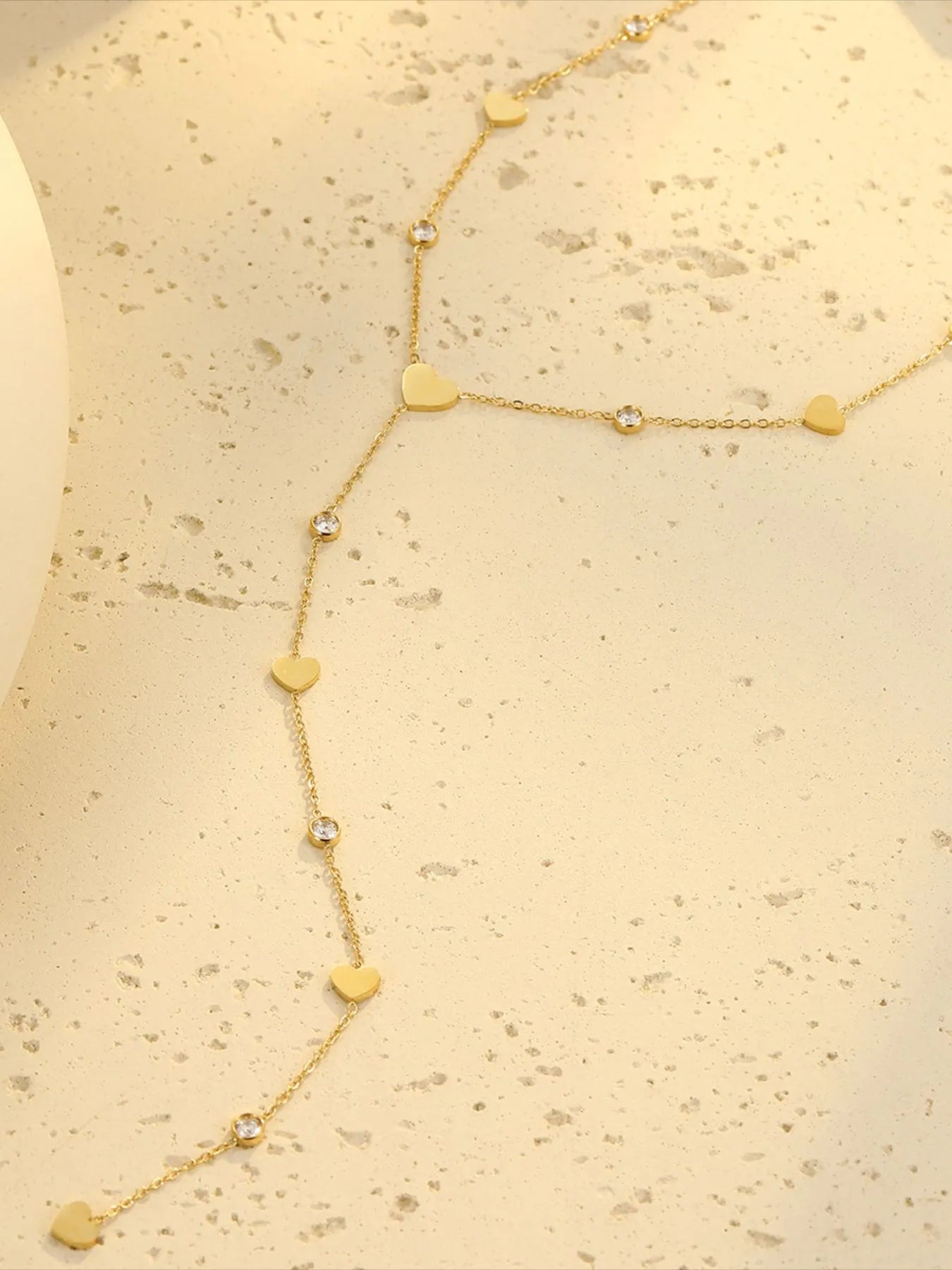Gold heart zircon long necklace with heart charms and round zircon stones