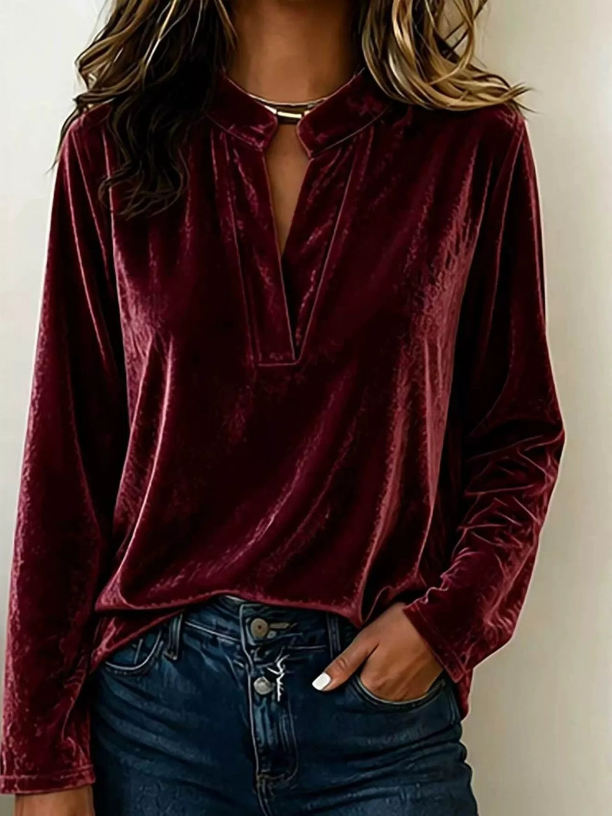 Burgundy velvet long-sleeve blouse with notched collar and V-slit neckline