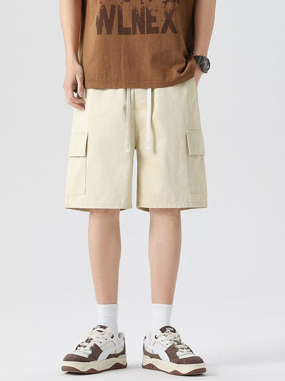 Men's light khaki cargo drawstring shorts with two side pockets and relaxed fit.