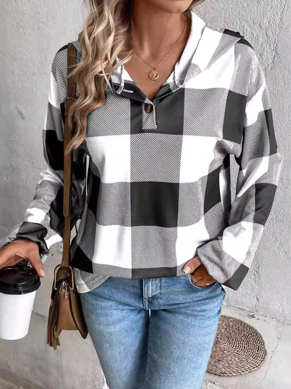 Plaid long sleeve hoodie with hood and drawstring in black and white, front view