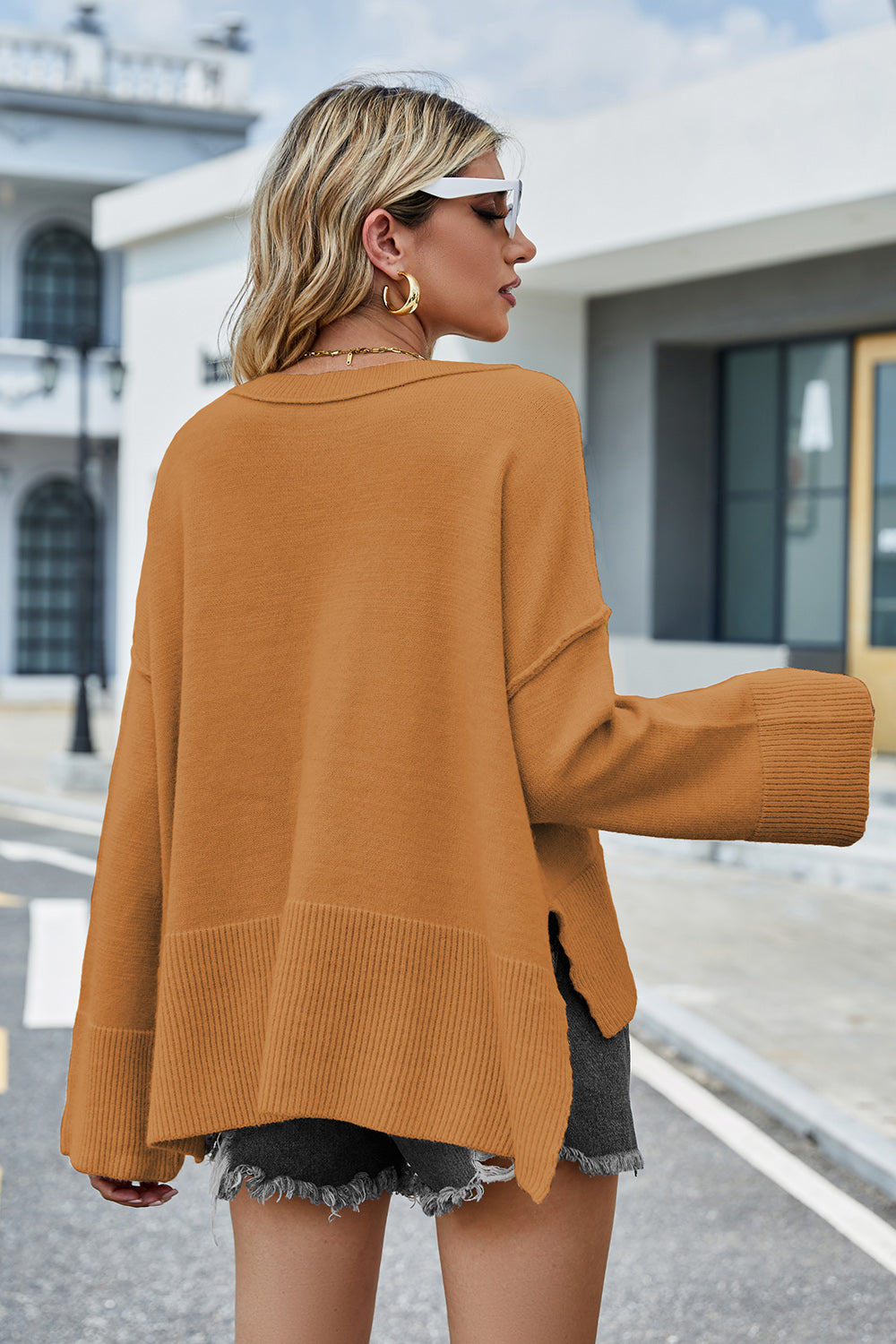 Ochre dropped-shoulder sweater with ribbed hem and long sleeves, back view