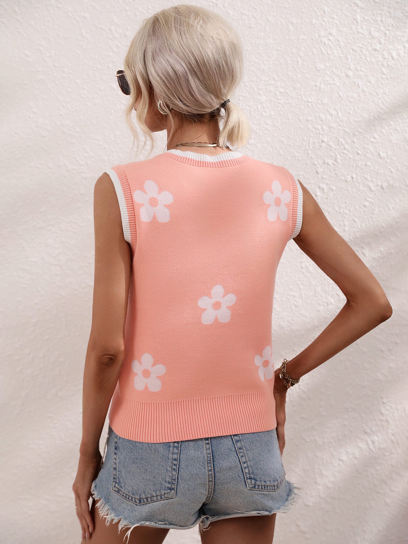Floral contrast ribbed trim sweater vest, coral pink back with white flower motif and ribbed trim