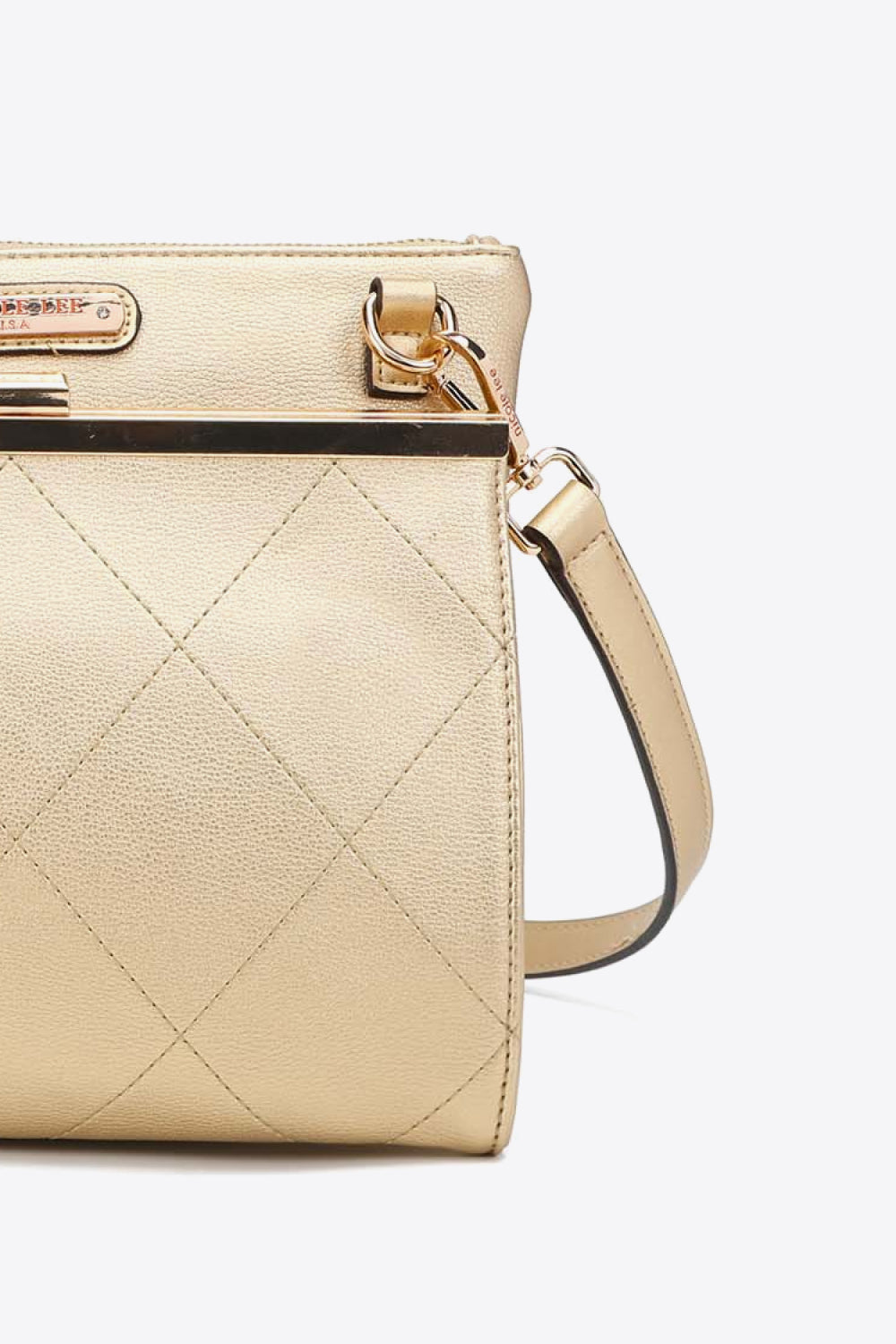 Beige quilted handbag side with crossbody strap and gold tone ring hardware