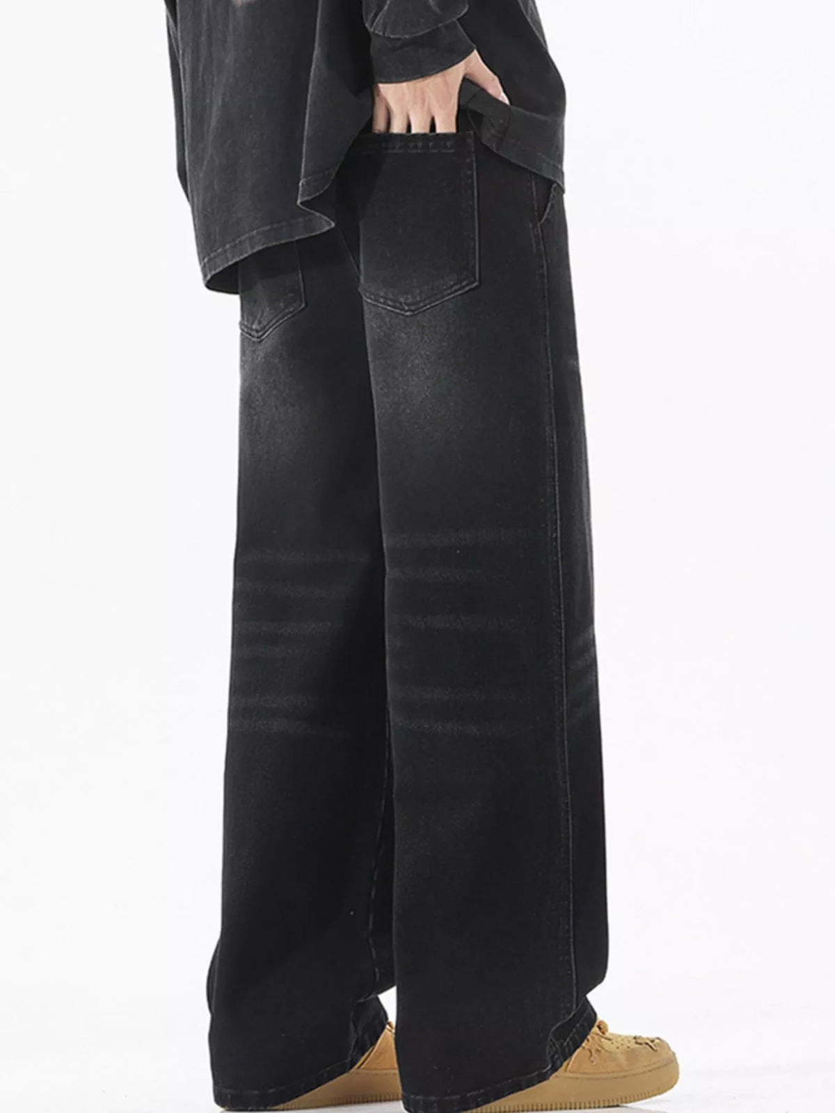 Men's black wide-leg cotton jeans with patch pockets and drawstring tie waist