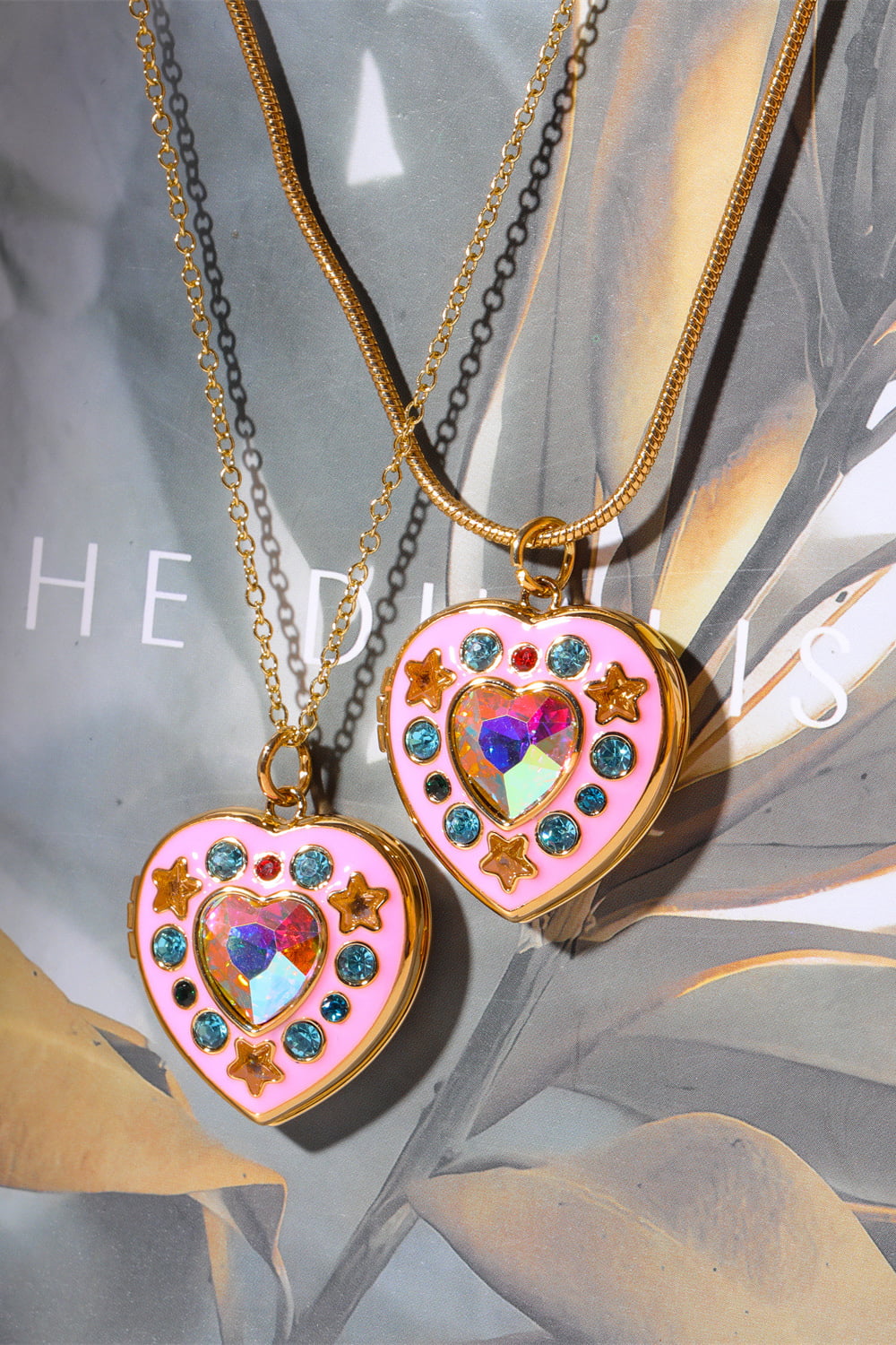 Two-tone heart box pendant necklace with gold chain and pink rhinestone heart charms