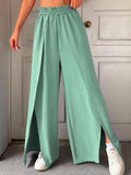 Mint green slit wide-leg pants with elastic waist and drawstring, side slit hem