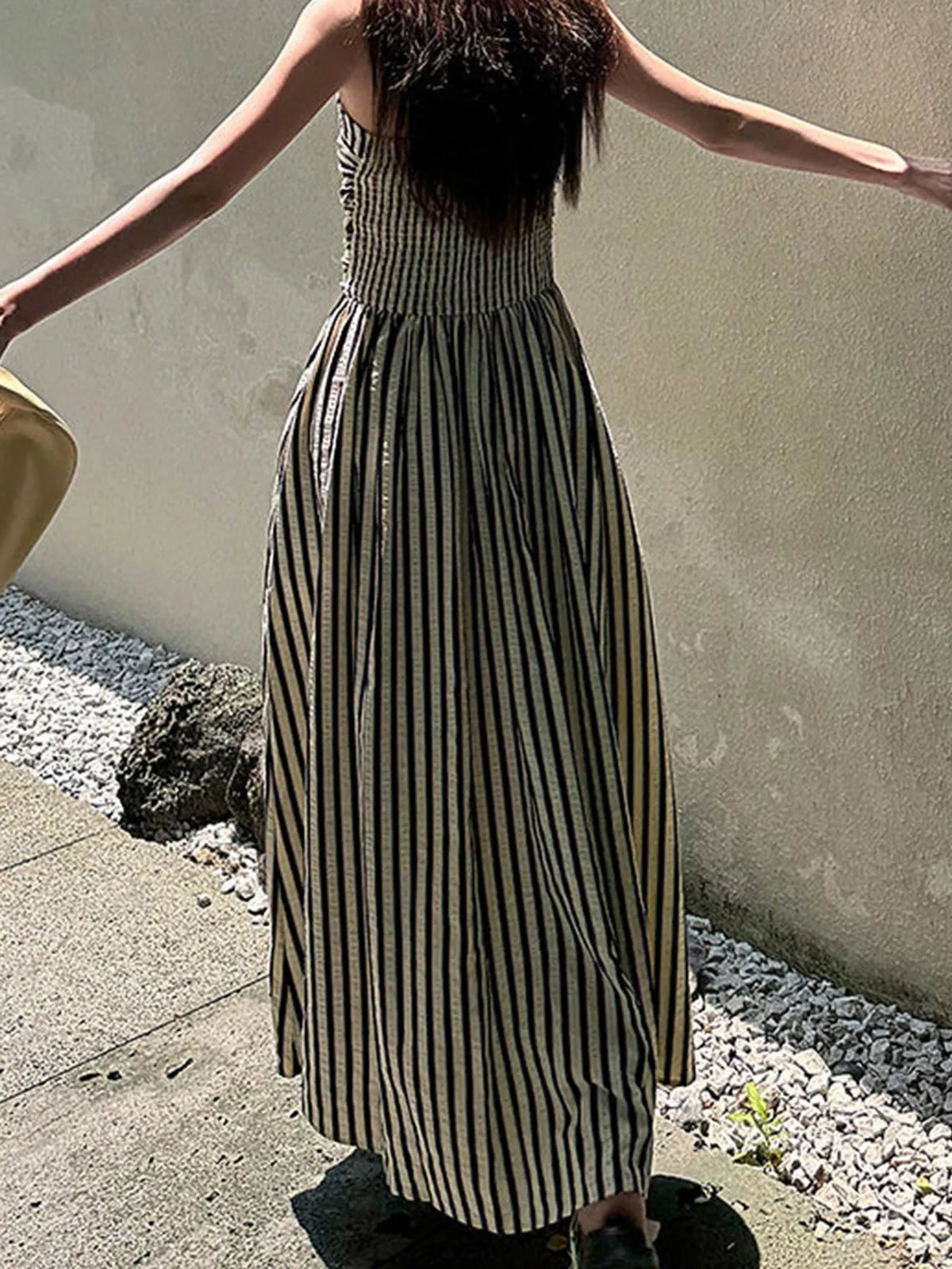 Sleeveless ruched maxi dress in blue-and-white vertical stripes, tiered skirt