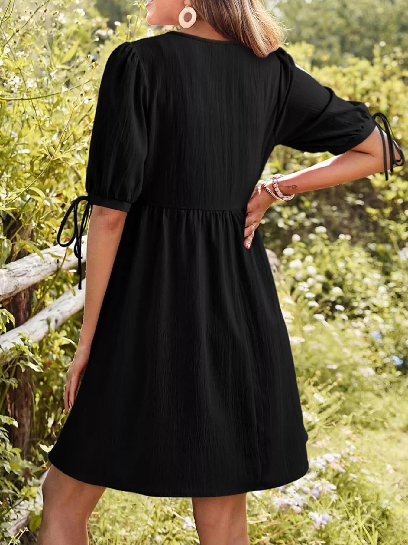 Tie-Neck Puff Sleeve A-Line Mini Dress in black worn by model