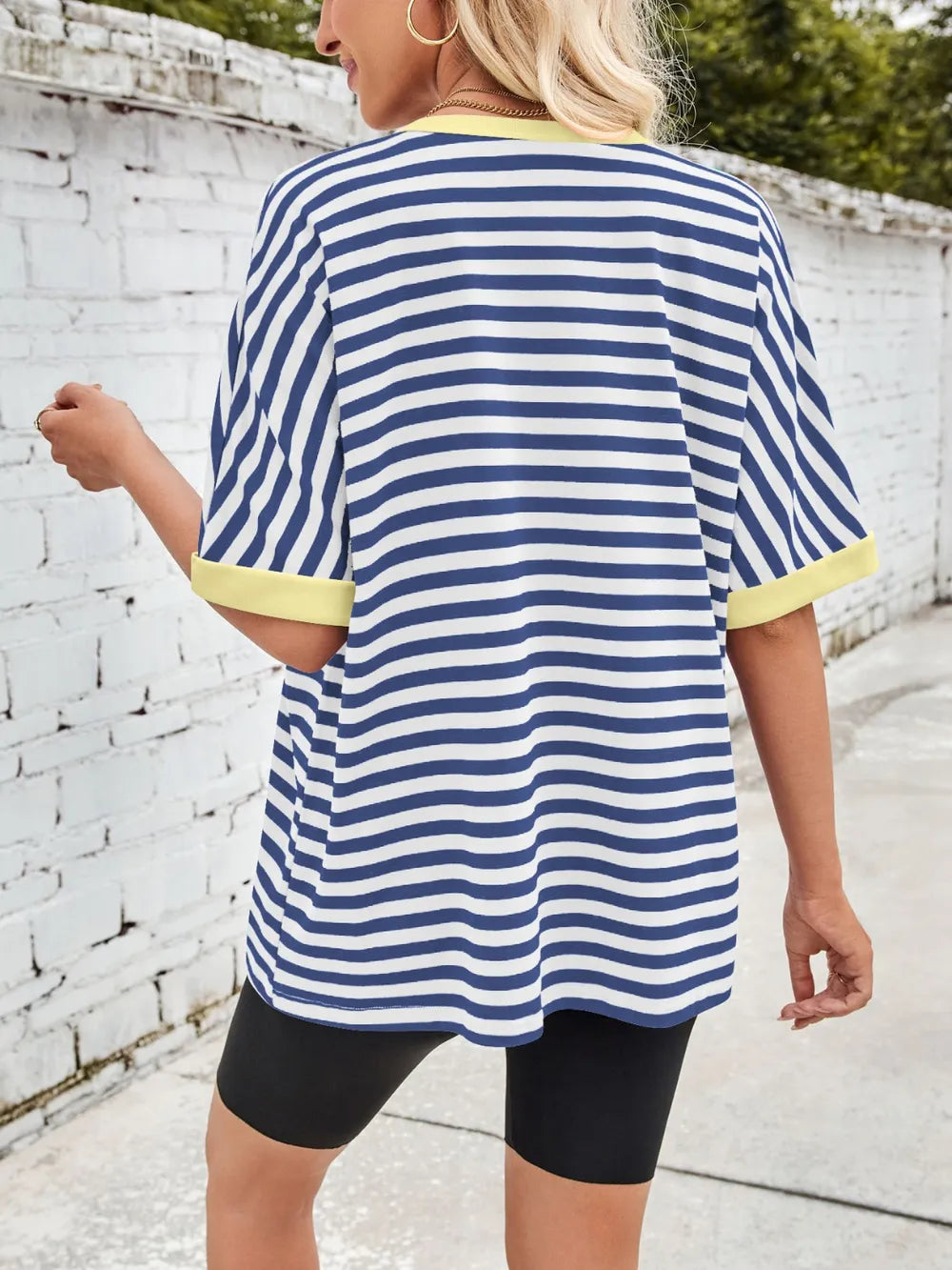 Back view of blue and white striped round-neck half-sleeve T-shirt with yellow trim
