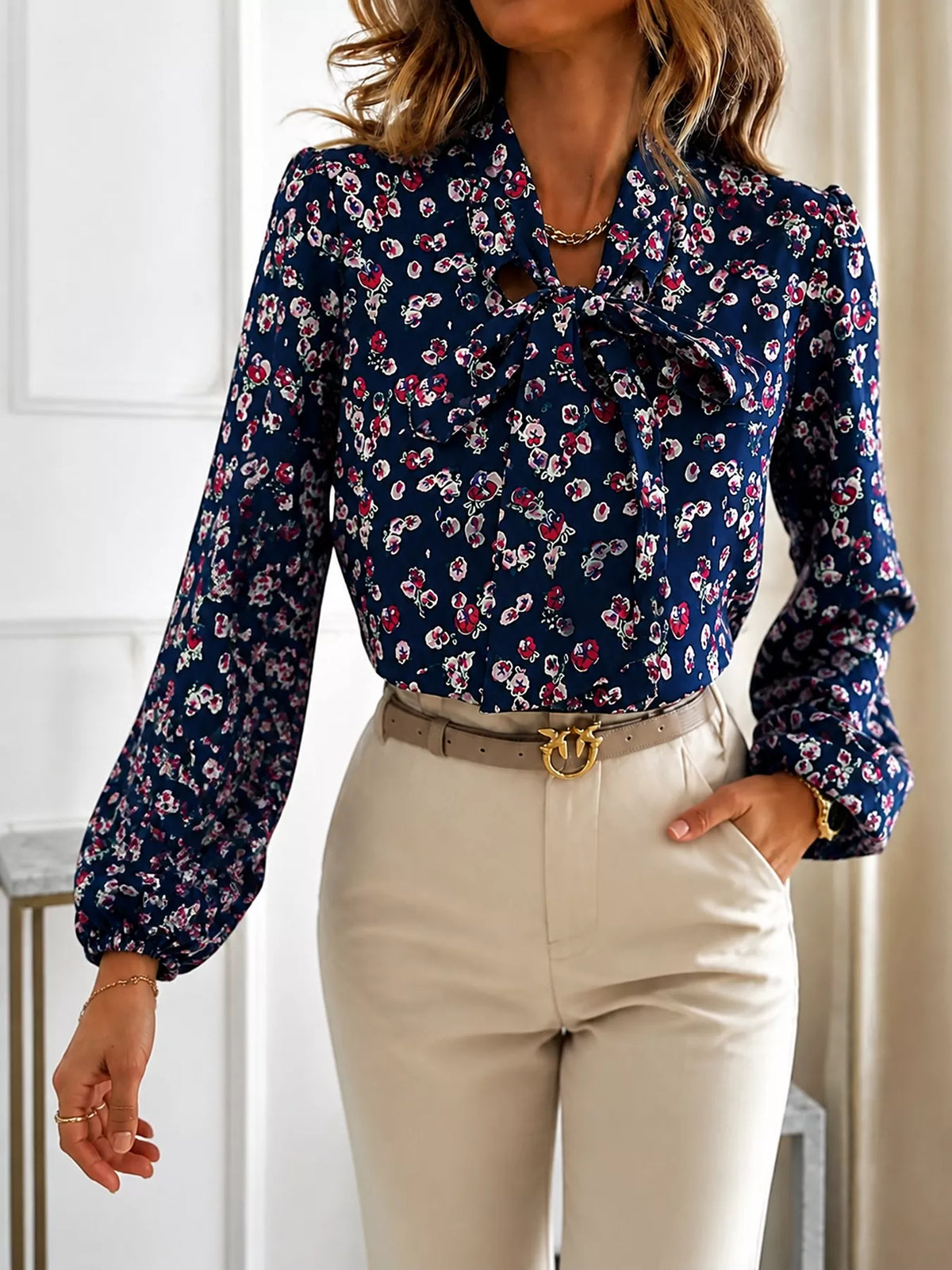 Navy printed long-sleeve blouse with bow tie neckline and button front