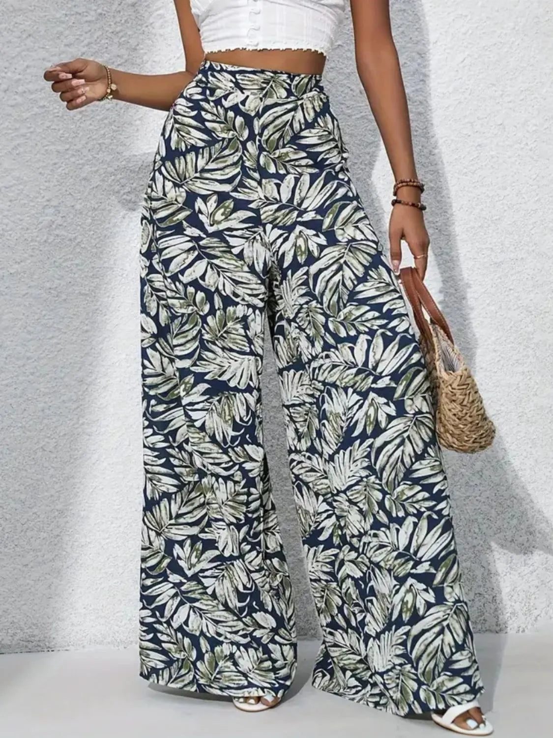 Printed high-waist wide-leg pants, navy and white leaf print, gathered waistband look