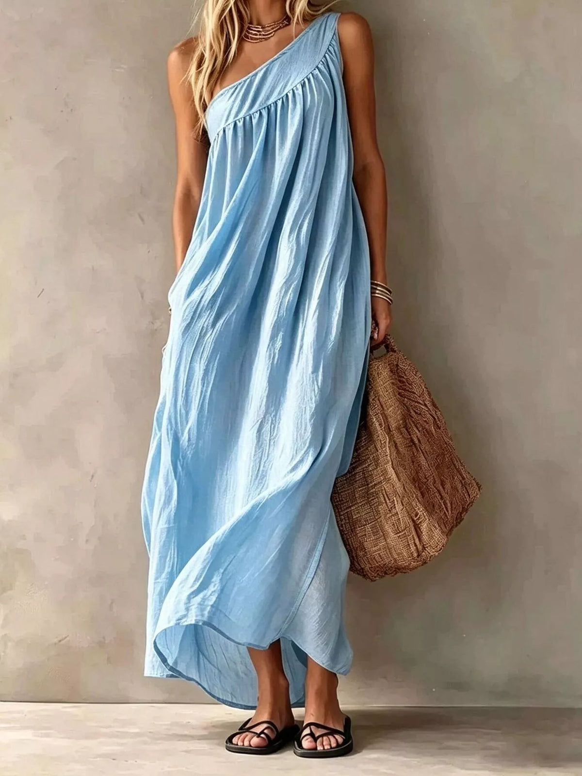 Light blue one-shoulder stretch maxi dress with gathered neckline and flowing skirt