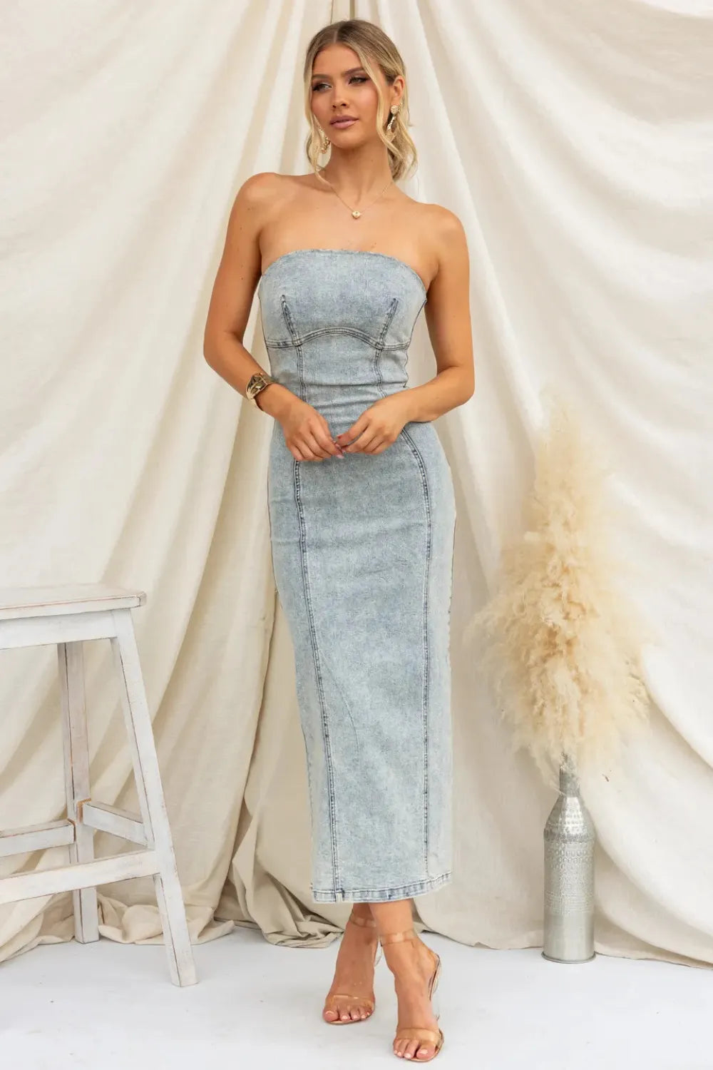 Light blue washed denim tube dress, strapless fitted midi with center slit